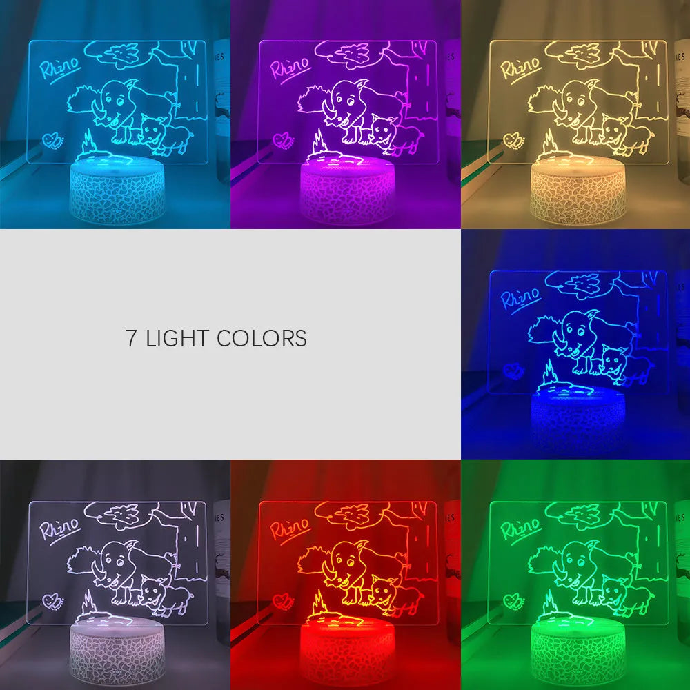 Rewritable night light with acrylic display panel, ABS base, and USB cable showing a drawn message