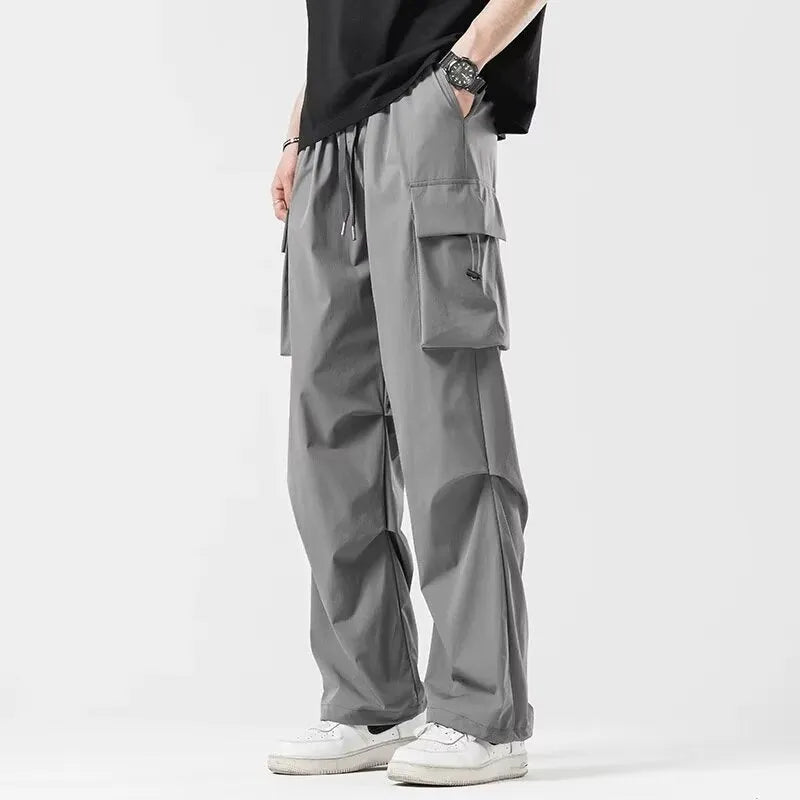 Men's loose straight cargo pants in black with wide-leg cut and drawstring waist