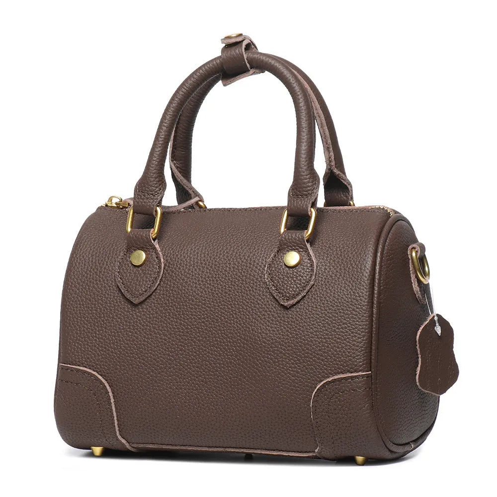 Brown yellow first layer cowhide Boston bag with cylindrical shape and single shoulder strap