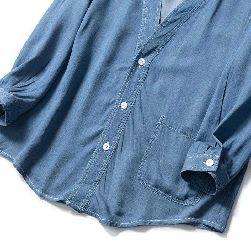 Men's dark blue casual denim coat with three-quarter sleeves and a V-neck collar.
