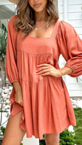 Light blue square collar puff sleeve backless A-line dress for a girl on a hanger.