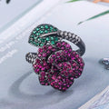 Geometric black gold ring with simulated red corundum stone and gold plating