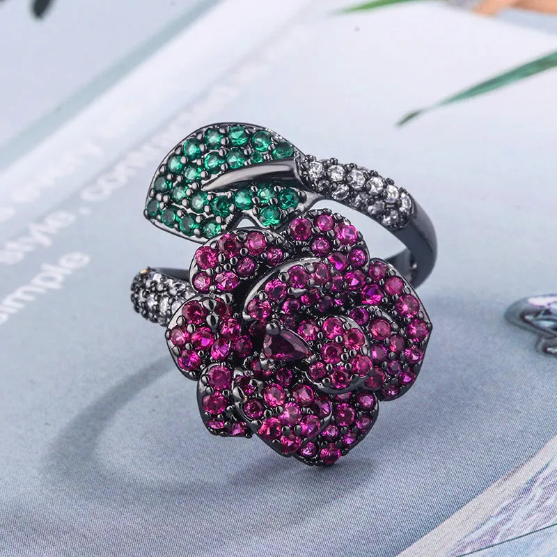 Geometric black gold ring with simulated red corundum stone and gold plating