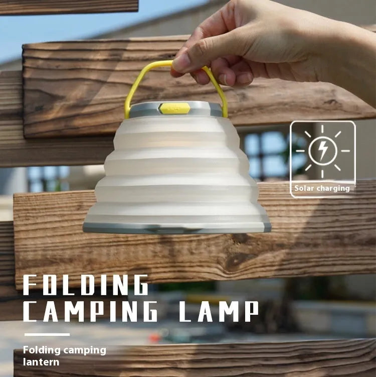 White portable camping lamp with a large capacity battery and a single control button.
