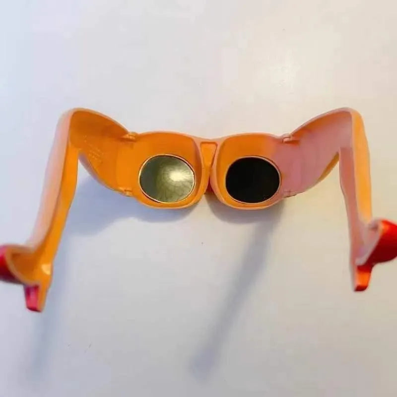 Orange plastic personality sunglasses with a novelty leg hip frame design.