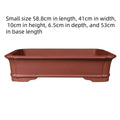 Large rectangular purple clay flowerpot for bonsai or big plants on a wooden surface.