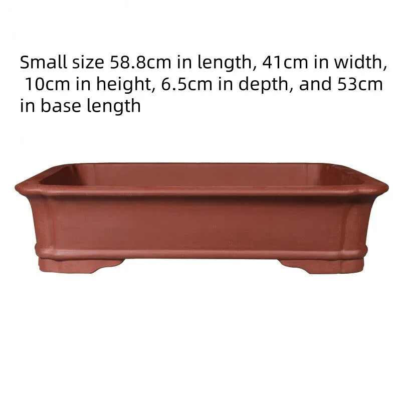Large rectangular purple clay flowerpot for bonsai or big plants on a wooden surface.