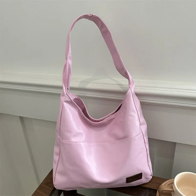 Women's retro large capacity PU bucket tote bag in Korean style with sewing thread detail, shown in coffee colour