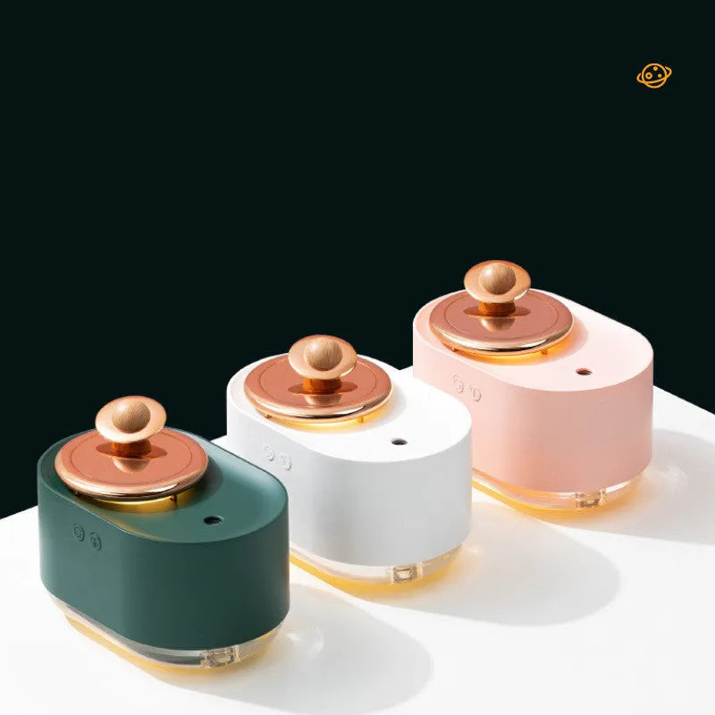 Green rotating planet USB humidifier with night light on wooden surface