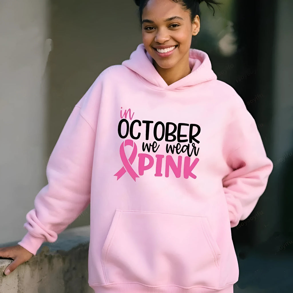 Women's pink sweatshirt with 'I'm A Survivor' retro graphic print and a side seam pocket.