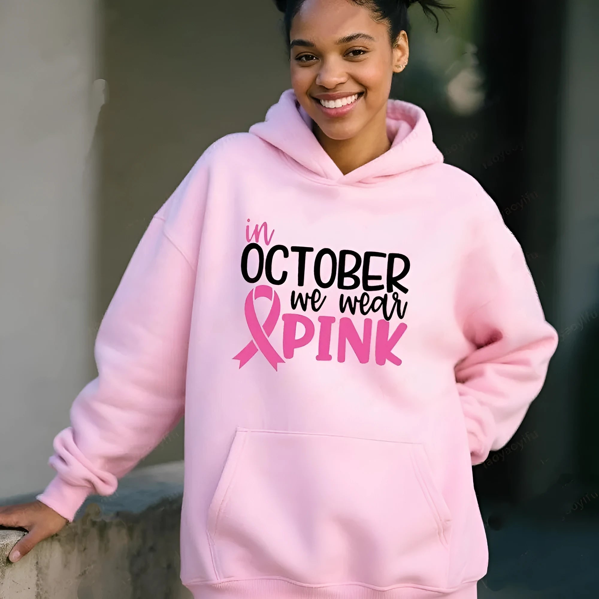 Women's pink sweatshirt with 'I'm A Survivor' retro graphic print and a side seam pocket.
