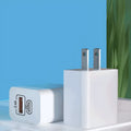 Bare metal travel charger for Android phones with multiple international plug adaptors