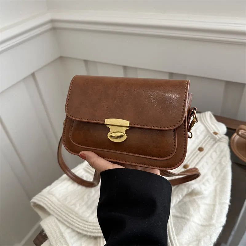 Small retro square shoulder bag in soft PU leather showing horizontal rectangular shape