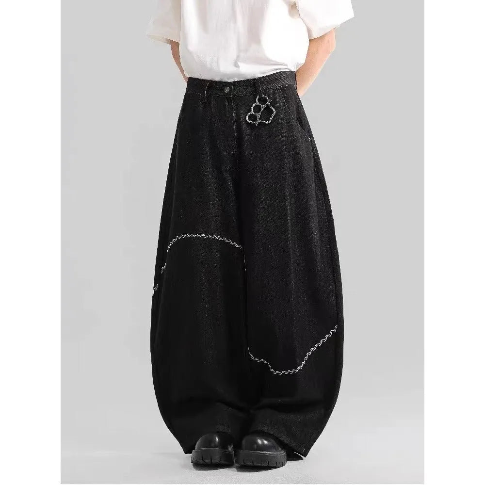 Black straight-leg denim trousers with micro-elastic waist and zip fly closure