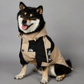 Khaki coloured polyester shell jacket for a dog, shown on a mannequin.