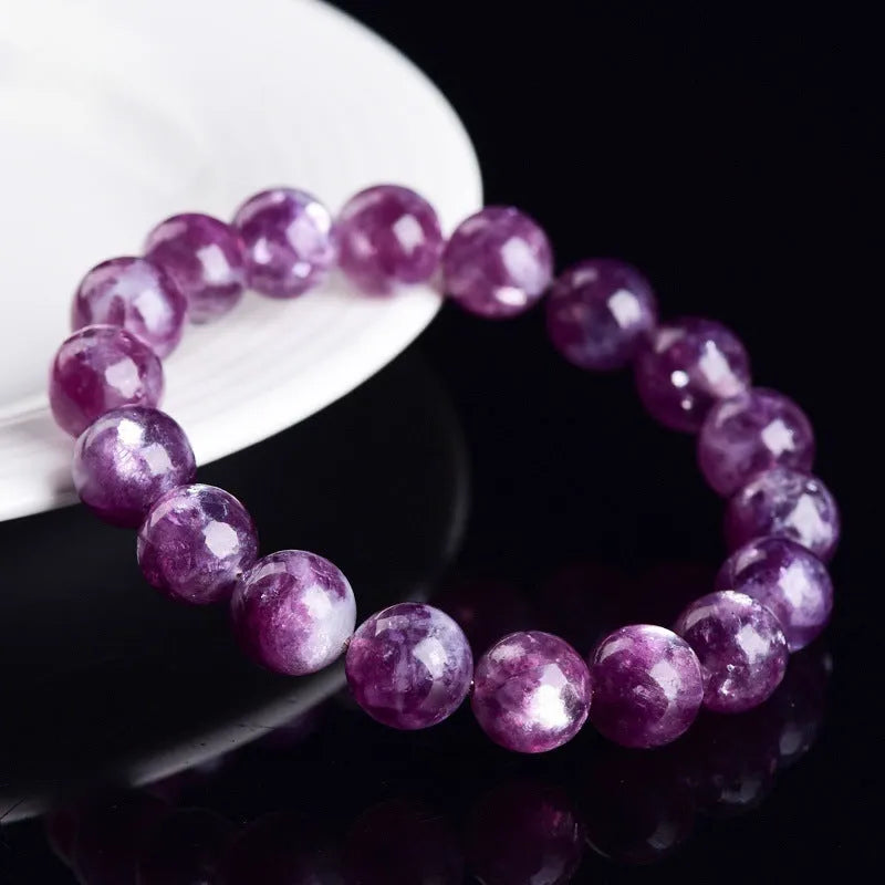 Grandmother Crystal bracelet with polished geometric beads in 5A purple on a white background.