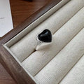 Adjustable sterling silver ring with heart-shaped black agate stone on open mouth design