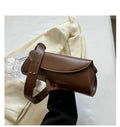 PU leather cylinder crossbody bag in black, horizontal square shape with crossbody strap