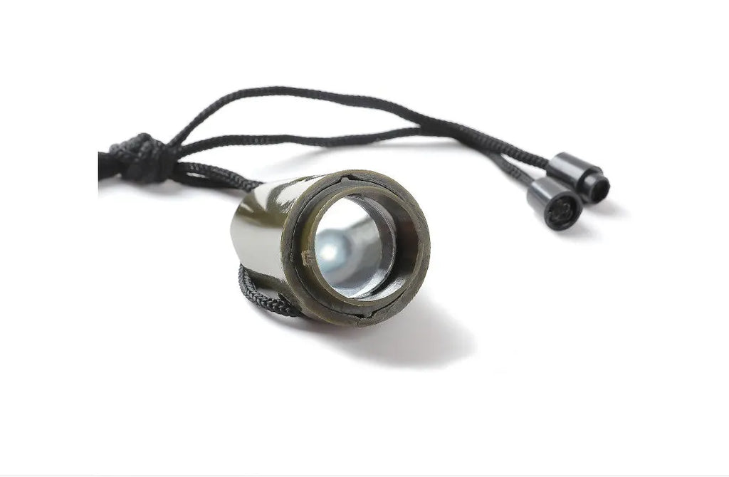 Outdoor Professional Seven-in-one Multifunctional Survival Whistle in army green with compass and whistle features