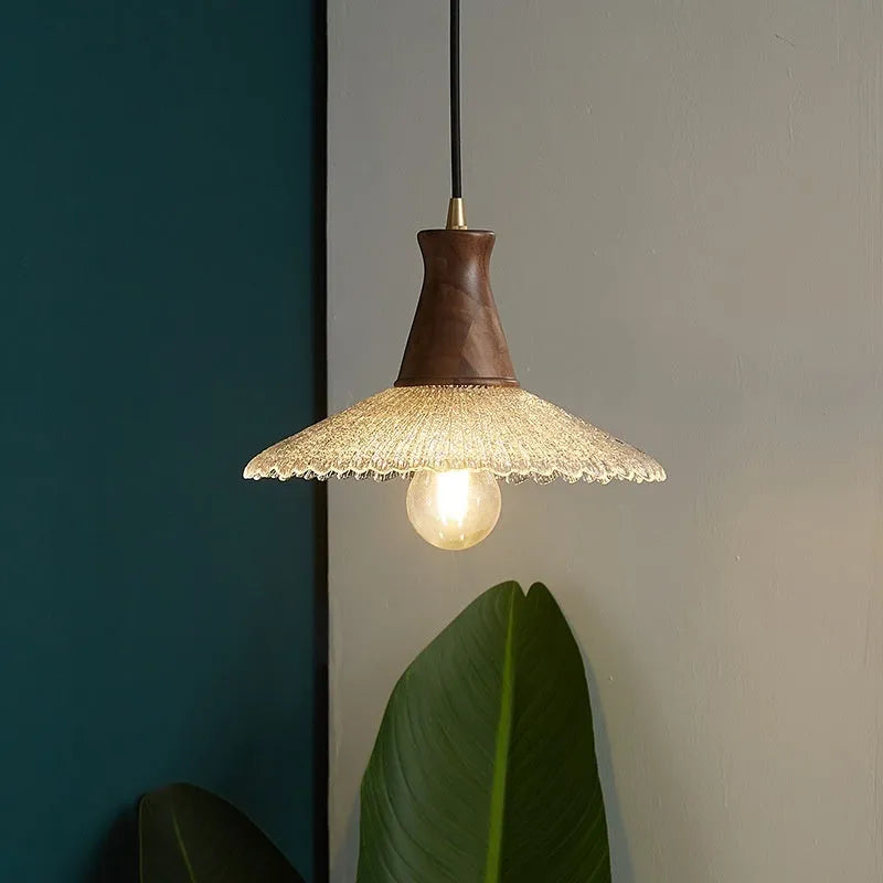 Wood and brass electroplated ceiling chandelier with a glass lampshade.