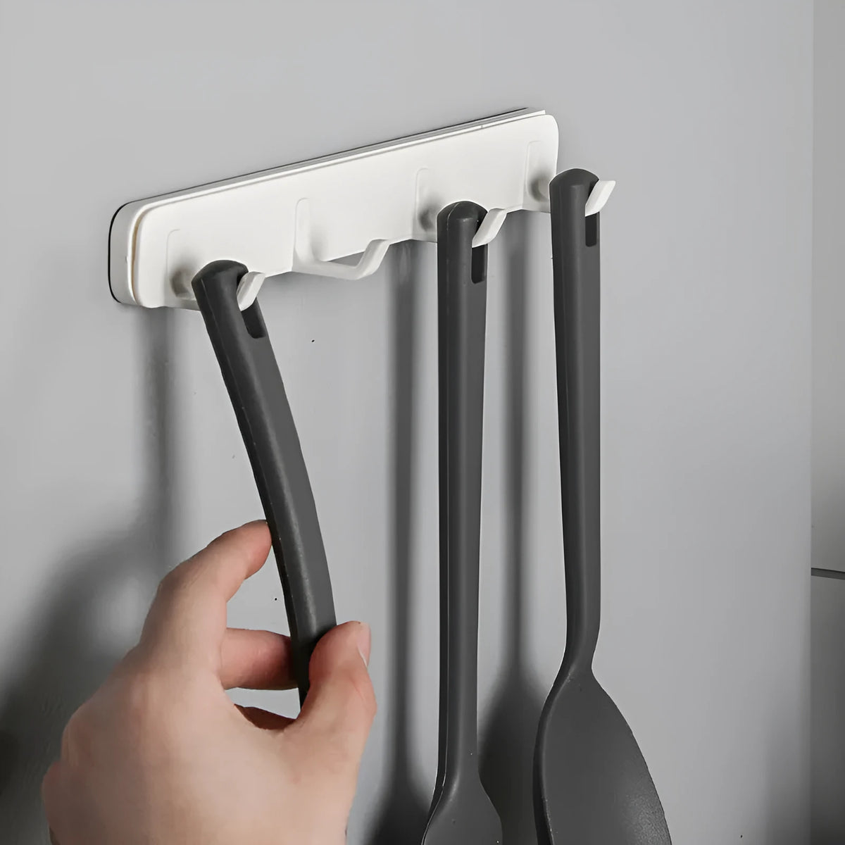 Four-row pull-out gap hook made of ABS plastic with U-shaped hooks and non-marking stickers for kitchen bathroom bedroom behind door storage