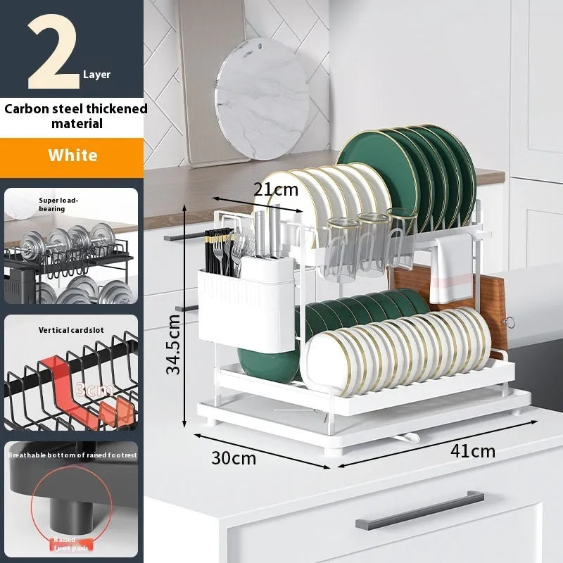 White double-layer kitchen storage and draining rack made from carbon steel on a countertop.