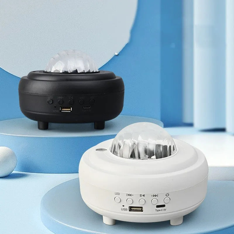 White galaxy star projector night light projecting blue star patterns on wall