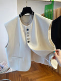 Loose-fitting beige waistcoat dress with bandage style, pockets, and a short 40cm length on a hanger.