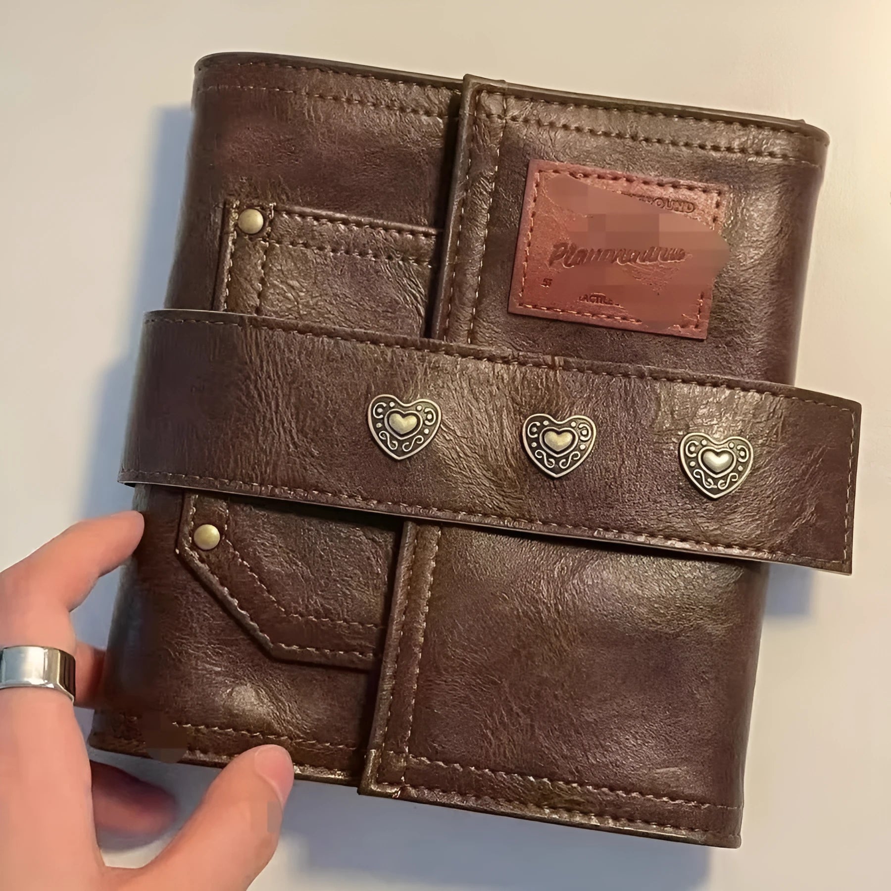 Brown retro leather buckle notebook in A7 size with PU cover and loose-leaf binding