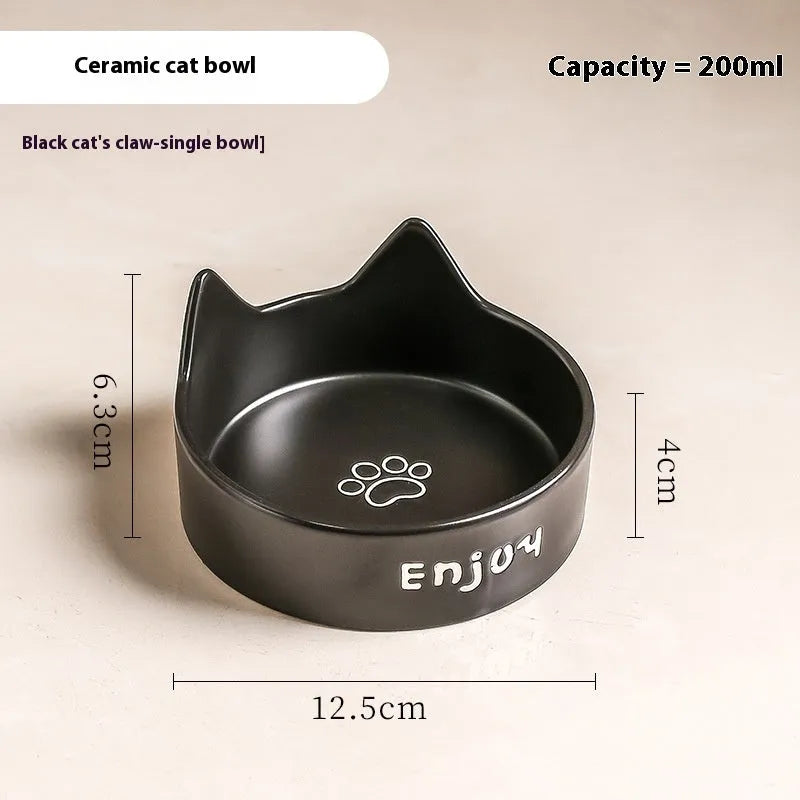 Porcelain cat bowl with cat ear and paw design on a wooden feeding frame, in pink colour.