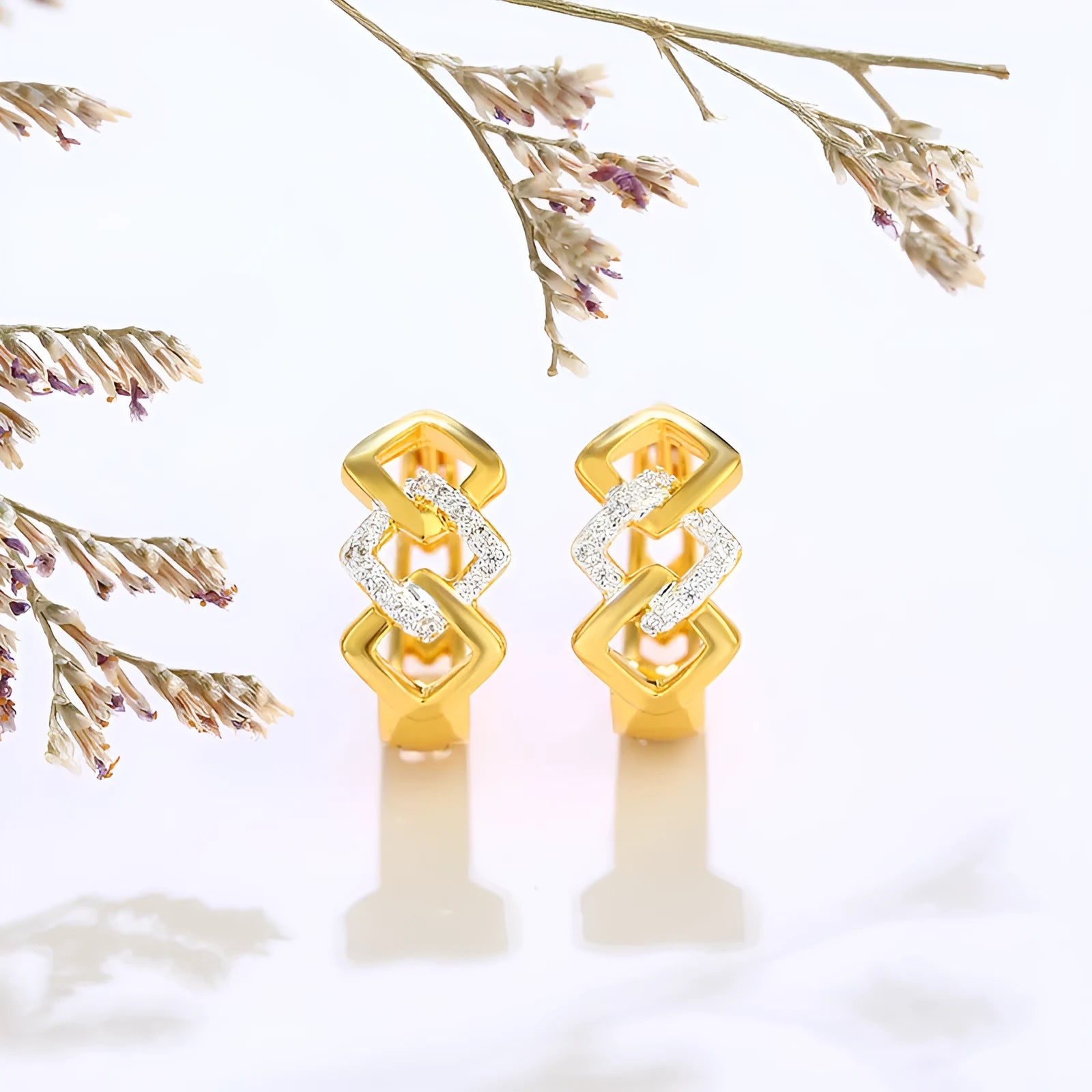 Gold geometric hollow-out earrings with electroplated alloy construction and ear clip fastening