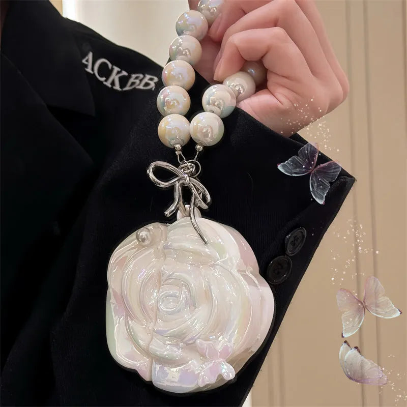 Pearl white camellia silicone AirPods case with lanyard, laser pearlescent finish