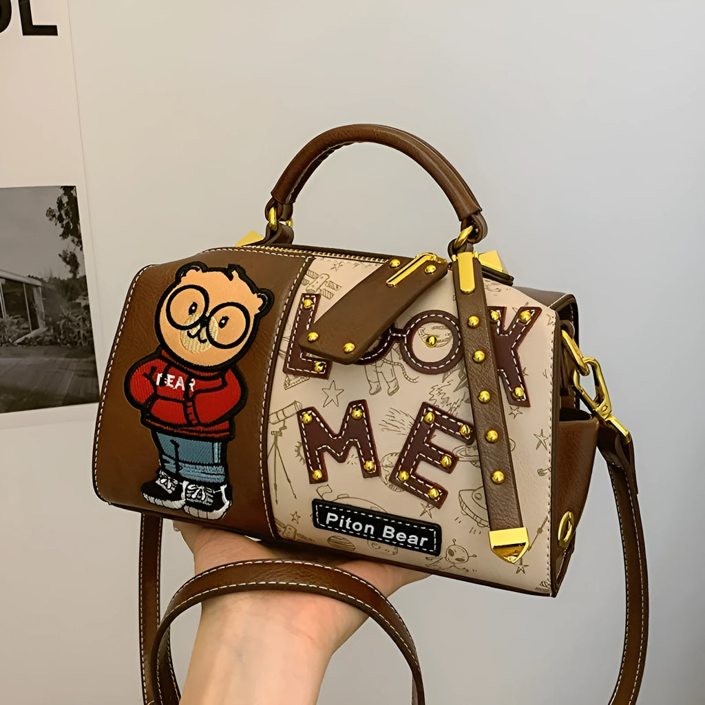Brown PU handbag with printed cartoon design, horizontal square shape, and single shoulder strap