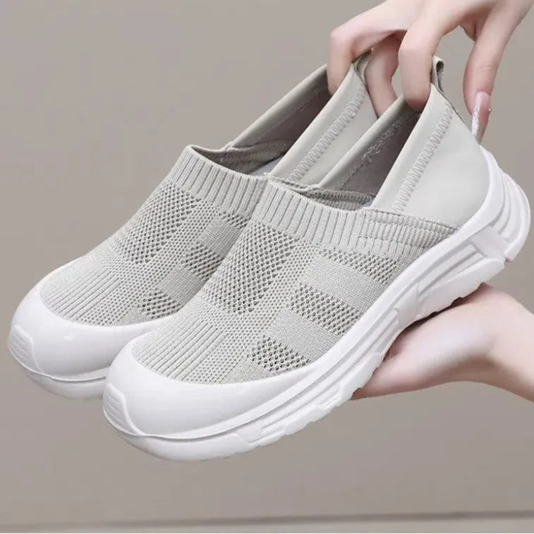 Women's slip-on shoe covers with cloth uppers and PVC soles in black, milky white, and purple colours
