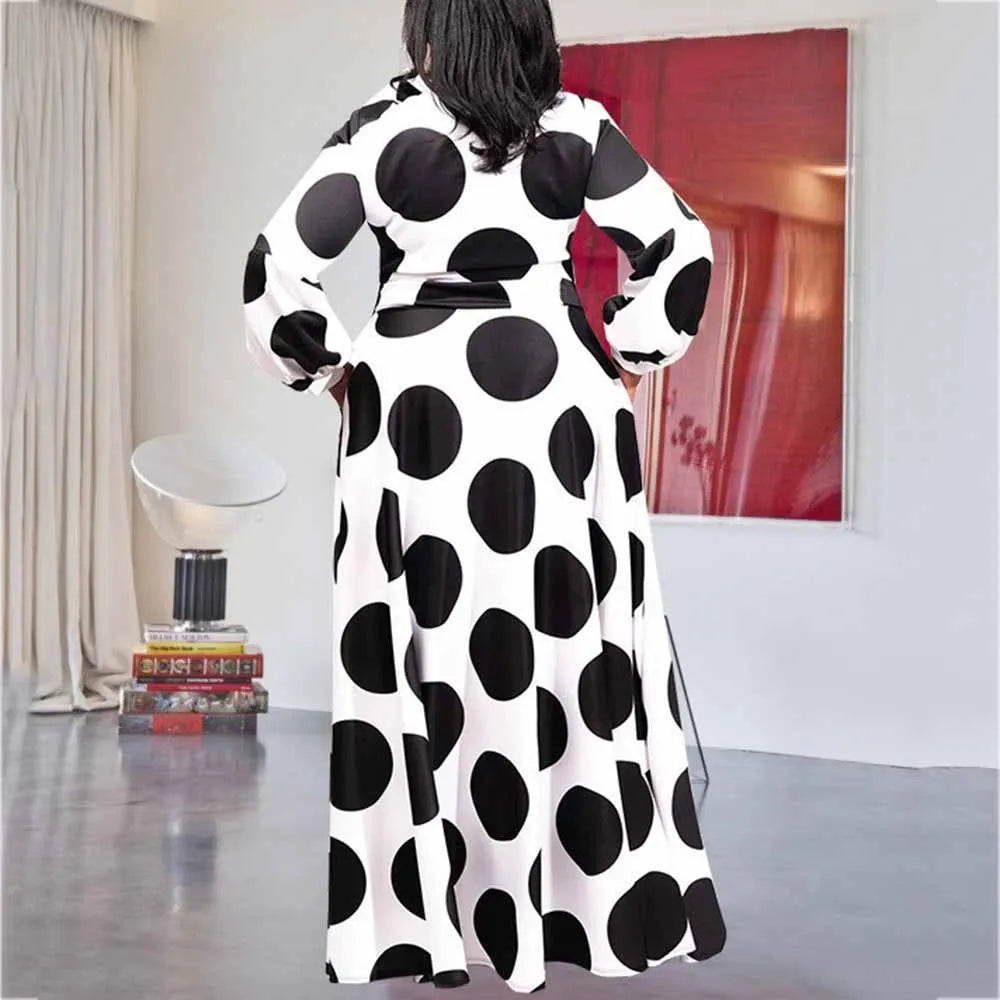 Women's large size white polka dot dress with long sleeves and long skirt, front view