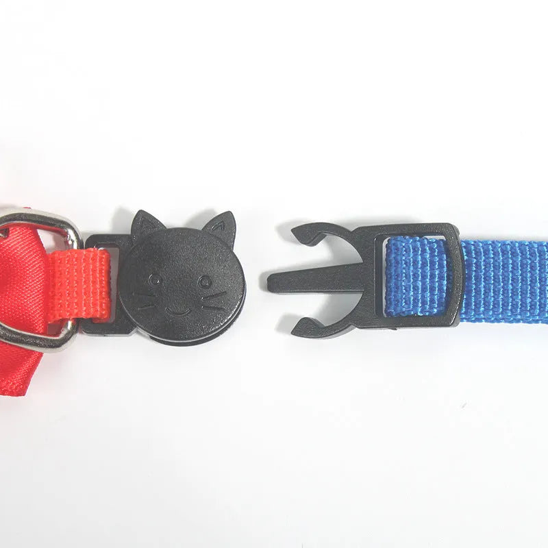 Colourful striped nylon bow collar for cats with an adjustable strap and small bell attached.