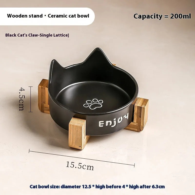 Porcelain cat bowl with cat ear and paw design on a wooden feeding frame, in pink colour.
