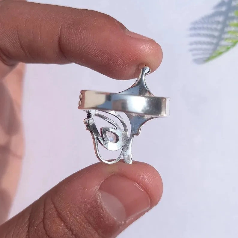 Retro wide hollow ring for women in silver zinc alloy electroplated finish on white background