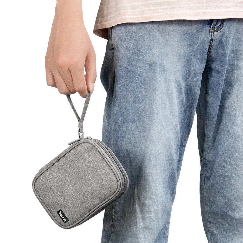 Black and grey oxford cloth protective cover for a 2.5-inch portable hard drive.