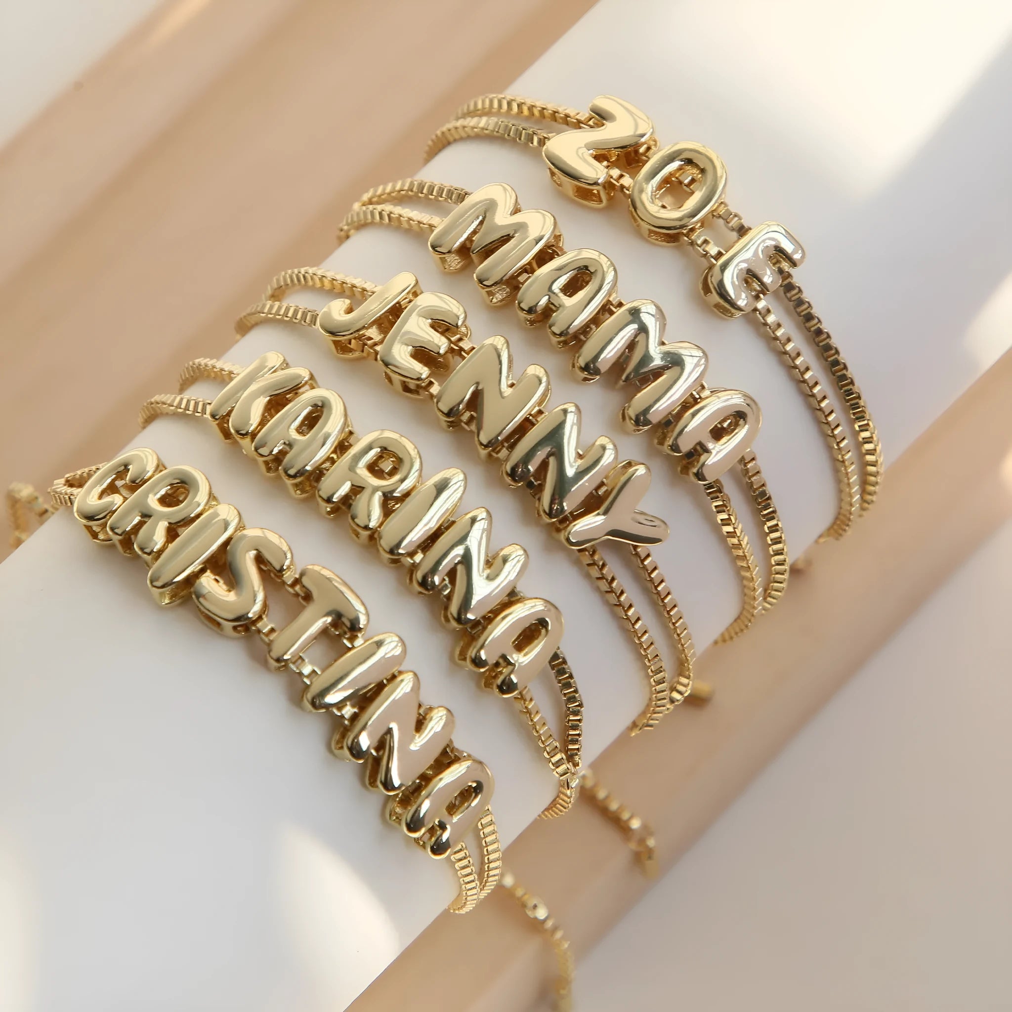 18k brass smooth surface bubble DIY letter bracelet with gold electroplated finish and letter pendant on white background