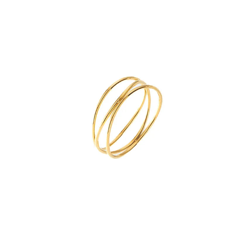 Gold titanium steel geometric ring with a three-layer coil design on a plain background.