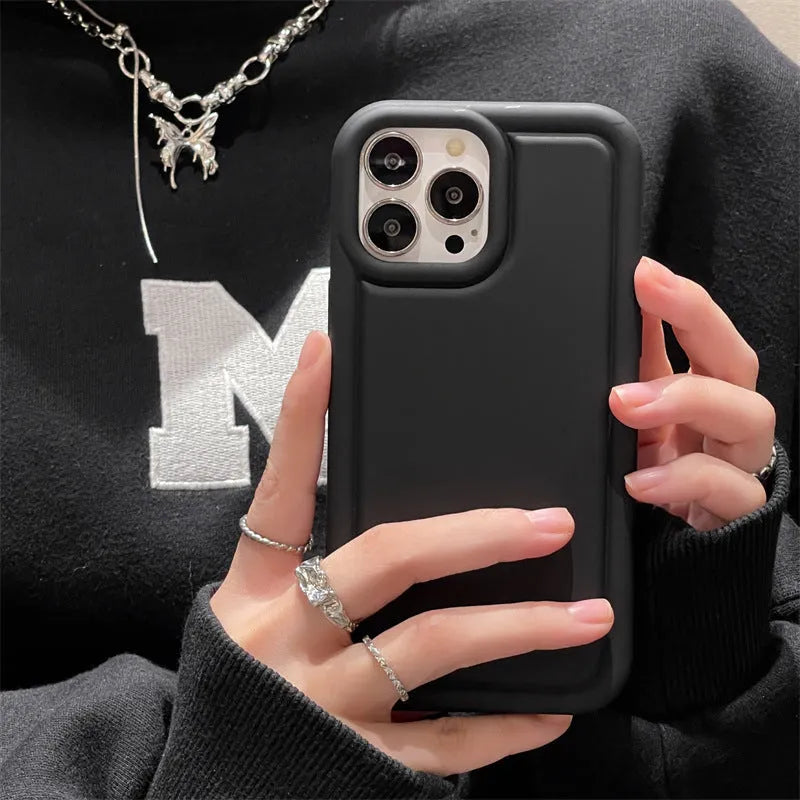 Silicone soft phone case for iPhone in black, showing rear cutout for camera and side buttons
