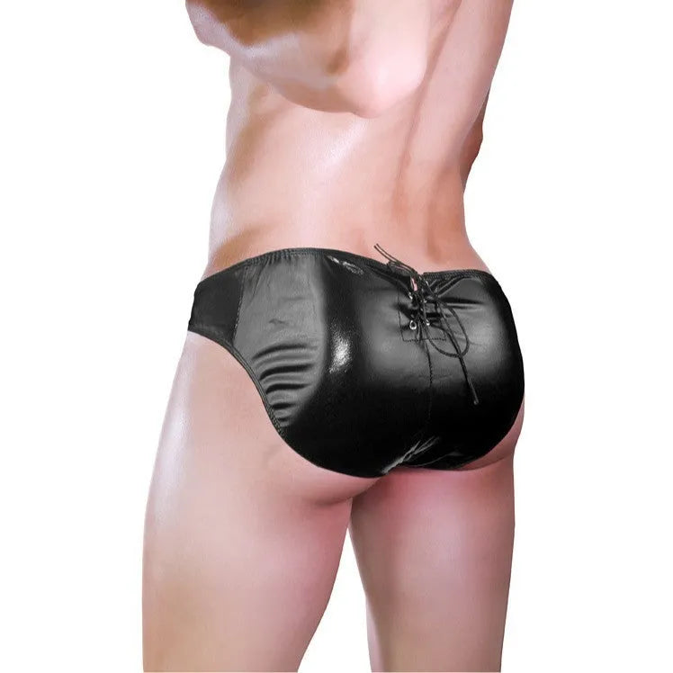 Men's black imitation leather string briefs laid flat showing stretch waist and sleek finish