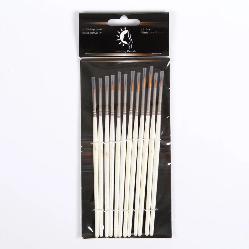 Set of 12 pearl white artists' brushes in a solid wood holder, sizes from 0 to 4/0 for watercolour and acrylic painting.