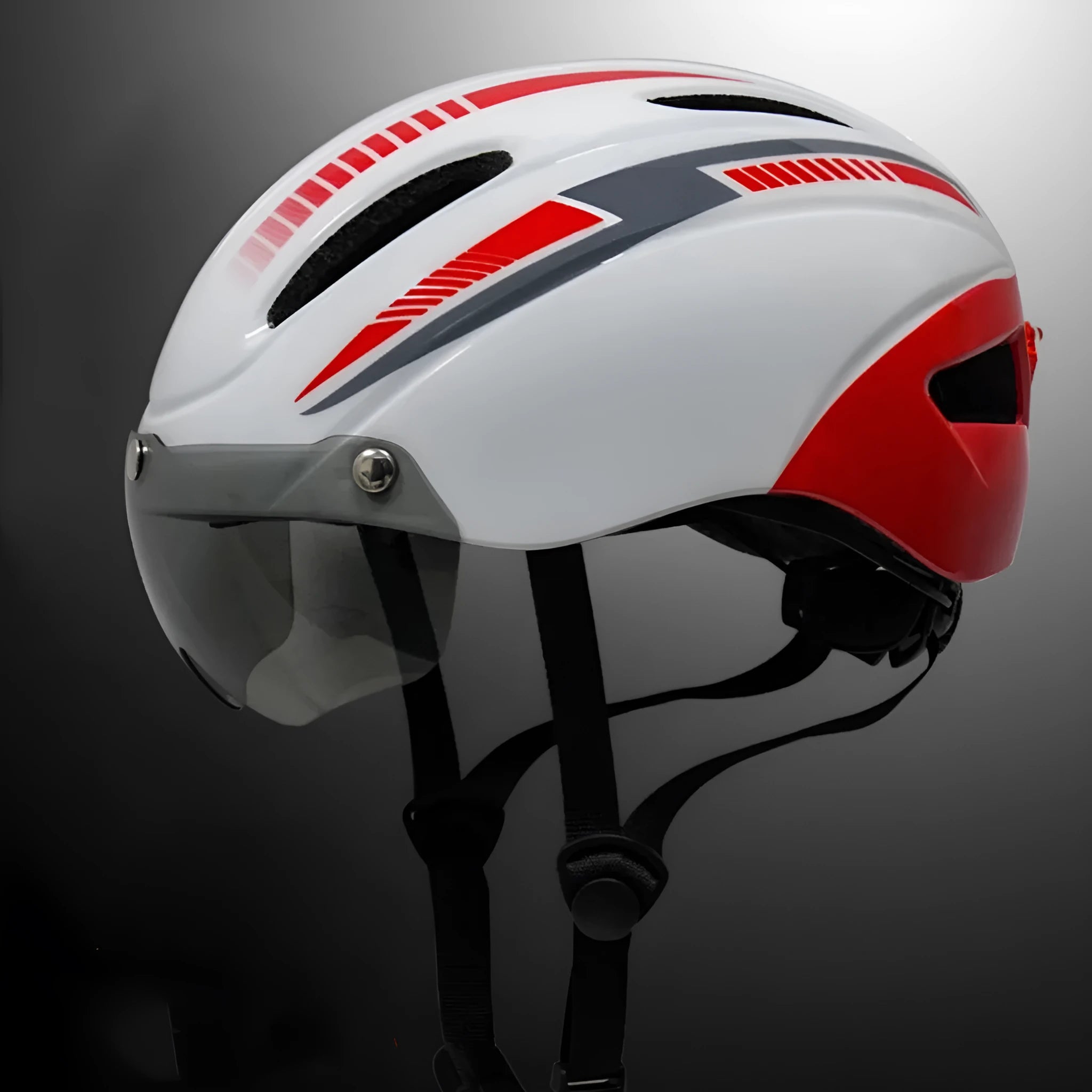 Adult unisex bicycle helmet in black with integrated taillight and goggles restraint