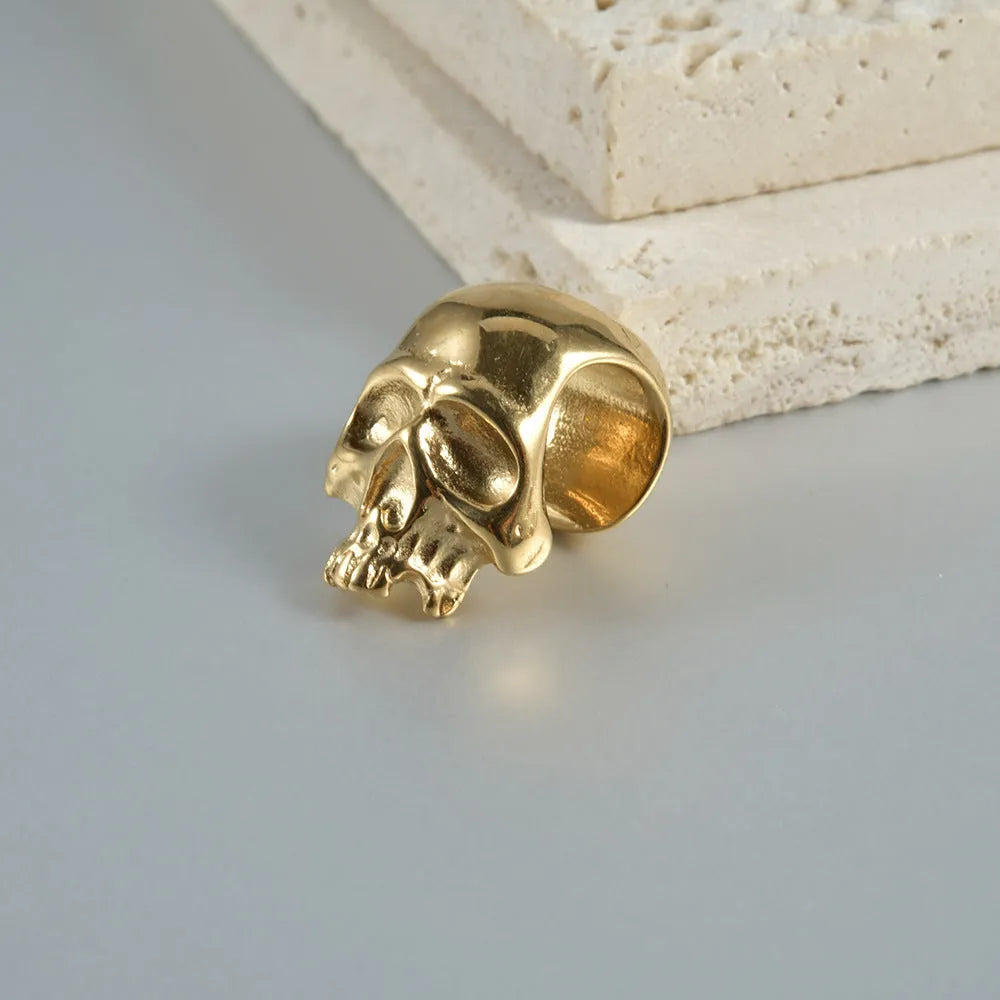 Stainless steel hollow skull and Buddha head geometric earrings in various electroplated colours.