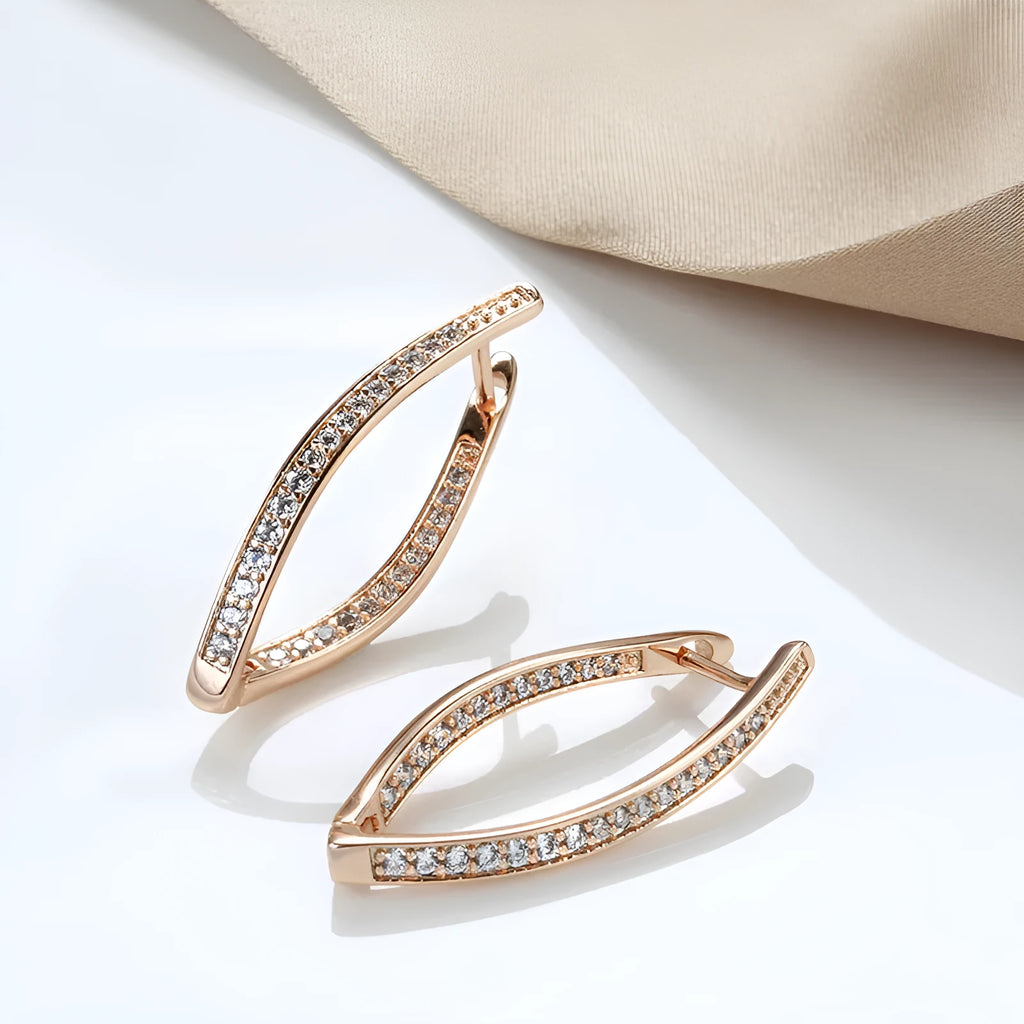Pair of H0493 copper geometric drop earrings with zircon accents for women on light background