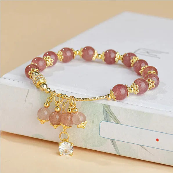 Pink crystal women's bracelet with heart-shaped charms and pearl decorative accents
