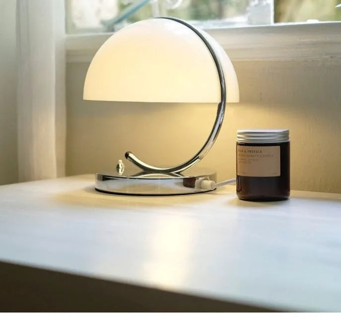 Retro space age table lamp with glass shade, LED light source, push button switch, available in orange or white.