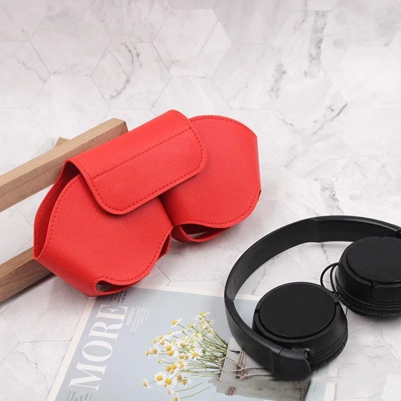 Black PU leather protective case for AirPods Max headphones with the lid open, showing internal sleeves.